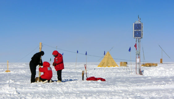people working on pole space weather outside