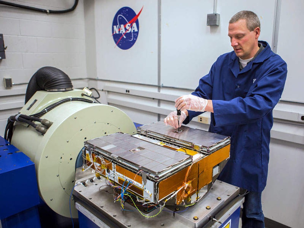 Jon Van Noord working on a machine at NASA
